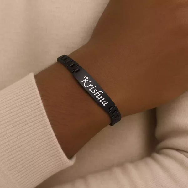 Black custom name bracelet for men with "Krishna" engraved, worn on wrist