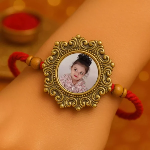 Girl image Rakhi tied on wrist with round dial and red thread