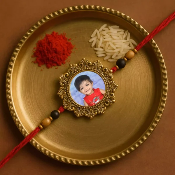 Personalised Rakhi with baby photo in golden dial on festive puja thali