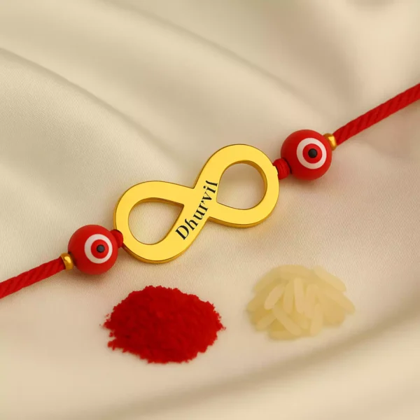 Infinity rakhi with red evil eye and name Dhurvil