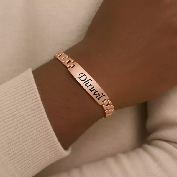 Rose gold personalized bracelet with "Dhruvil" engraved – Worn on wrist, custom men’s accessory