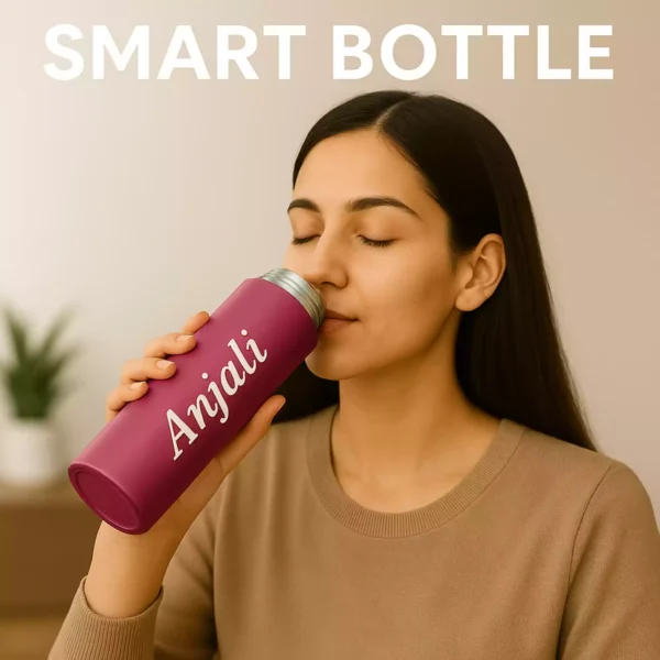 Woman drinking from personalized rose red smart bottle