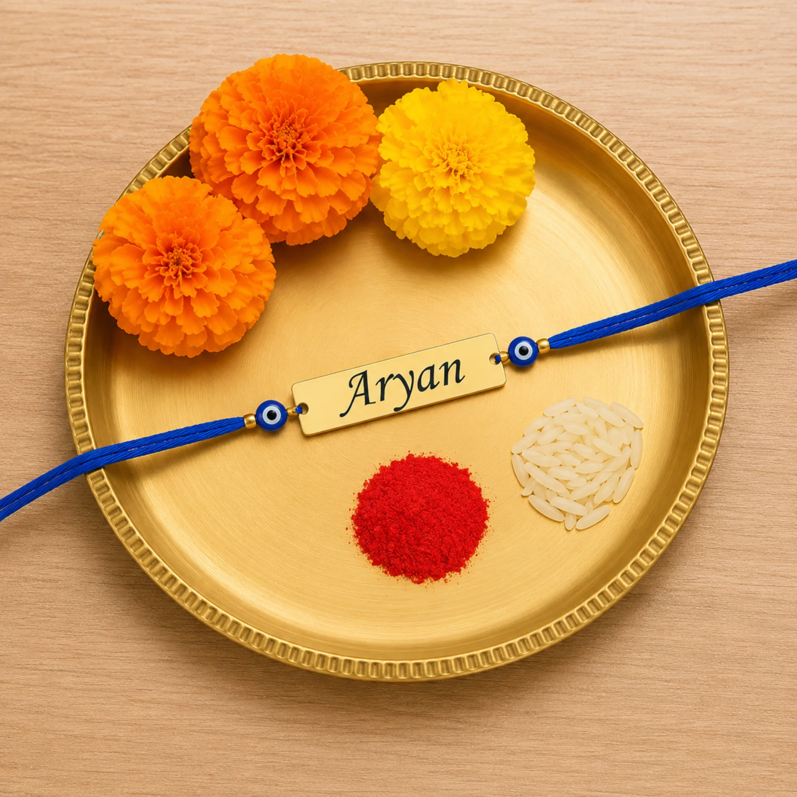 Personalized Blue Evil Eye Rakhi with custom name plate on festive Raksha Bandhan thali