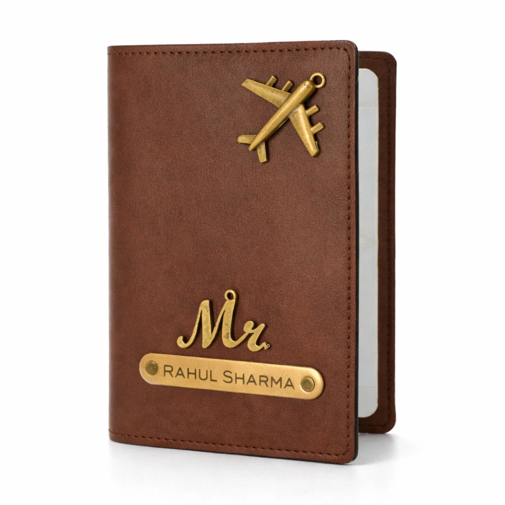 Personalized brown leather passport cover with custom name plate and airplane charm