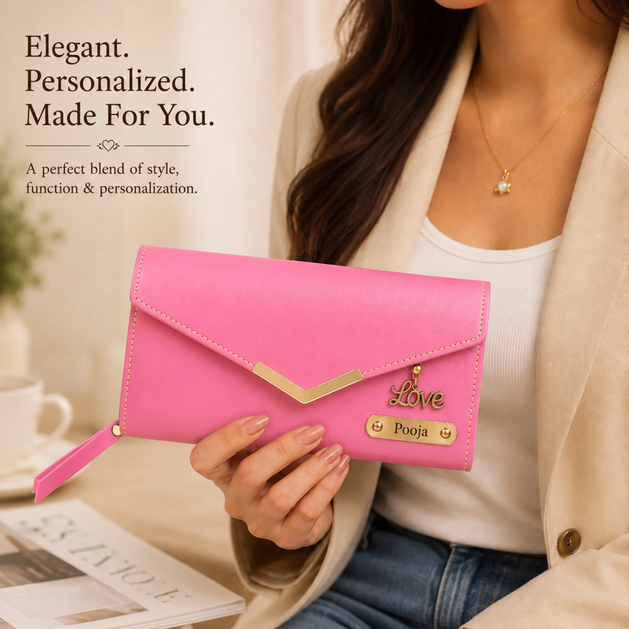 Woman holding a personalized pink clutch wallet with custom name plate and love charm