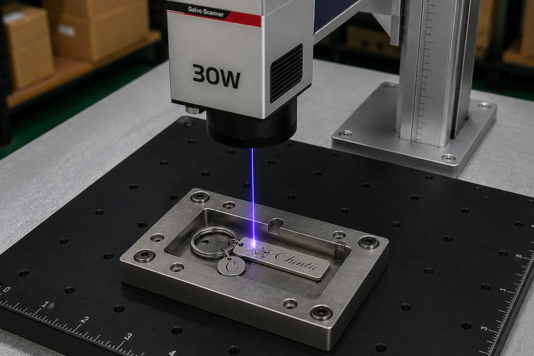 Laser engraving machine customizing a stainless steel name keychain at the Pijera workshop with precision engraving technology.