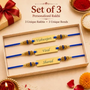 Set of 3 personalized blue thread rakhis with engraved stainless steel name plates, decorative blue stone beads, premium gift box presentation, and festive Raksha Bandhan elements.