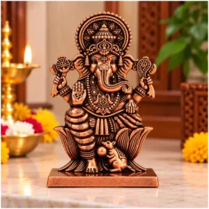 Copper Finish Ganesha Idol in white metal with ornate crown, lotus base and mouse design, displayed in a home mandir setting.