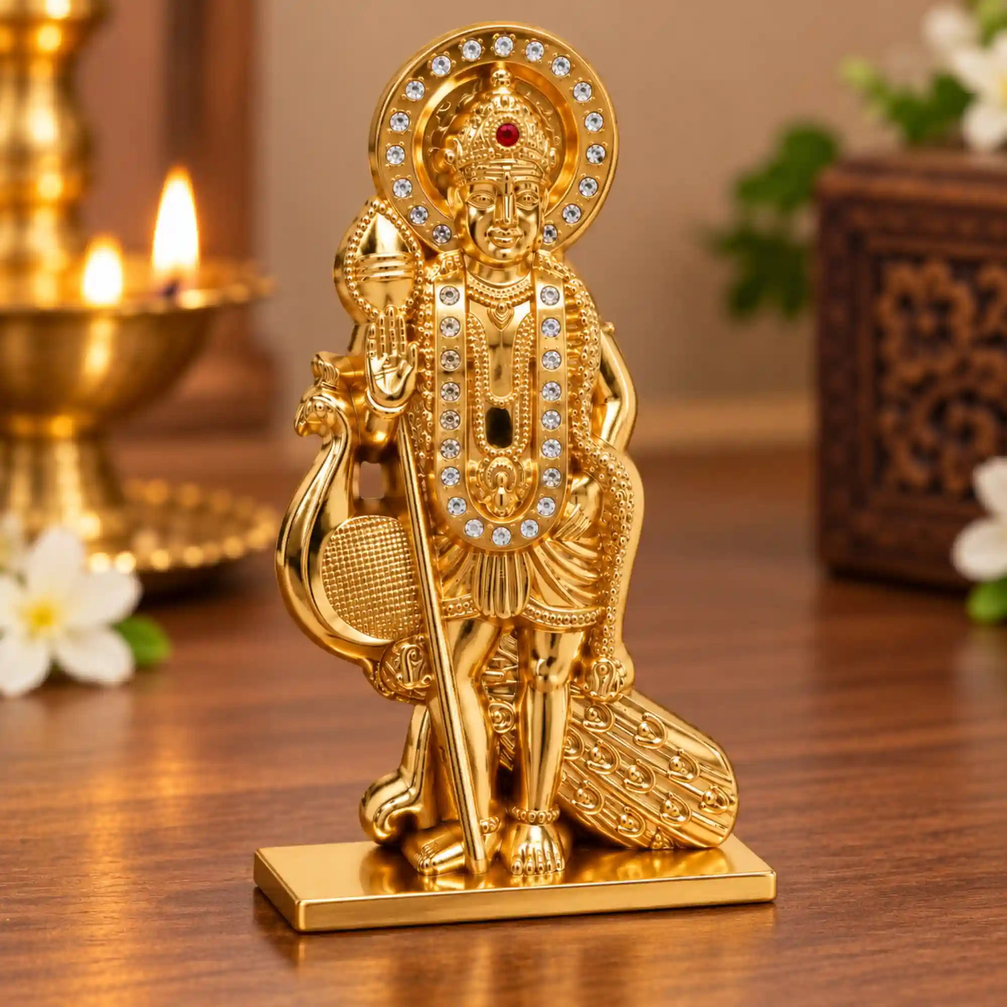 Detailed Lord Murugan idol with golden finish and decorative stone accents
